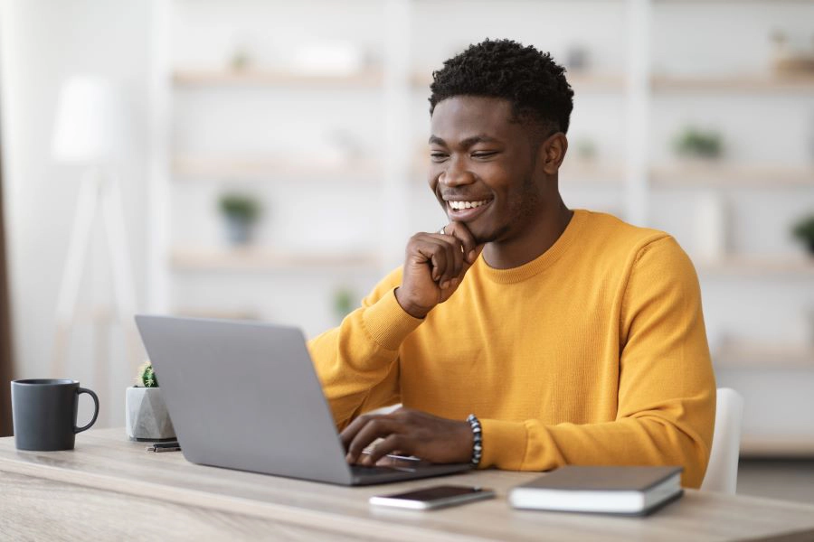 Happy person working on his laptop